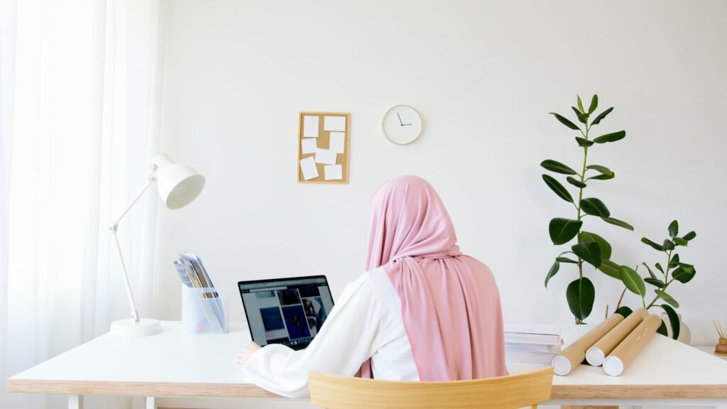 Woman in Pink Hijab Sitting on Chair